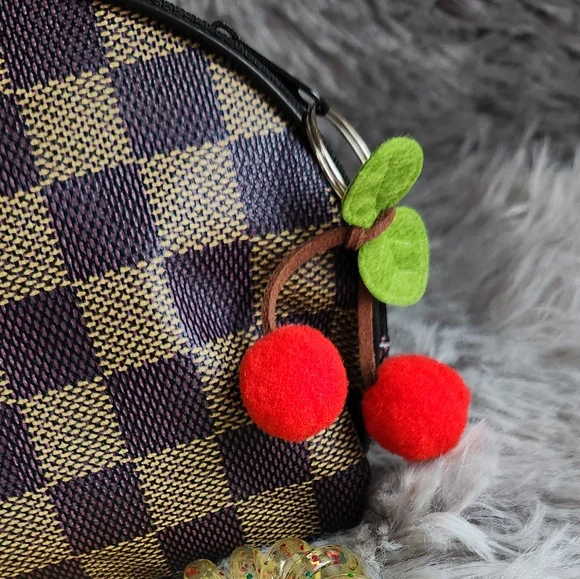 Checkered Cosmetic Pouch with Hair Accessories & Snail Mask - Picture 6 of 6